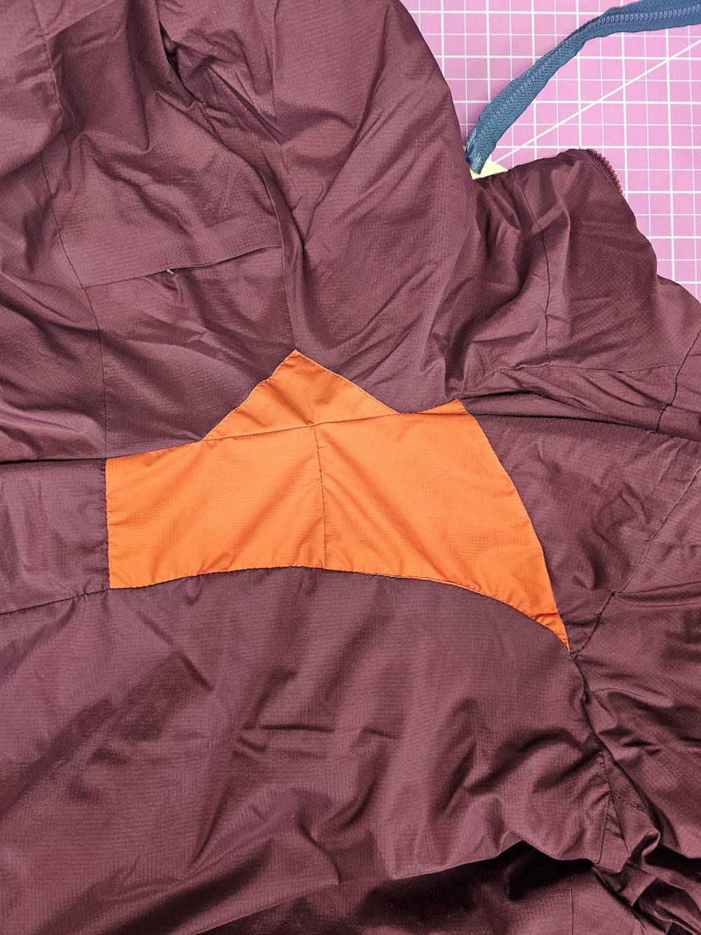 purple jacket repaired sewn