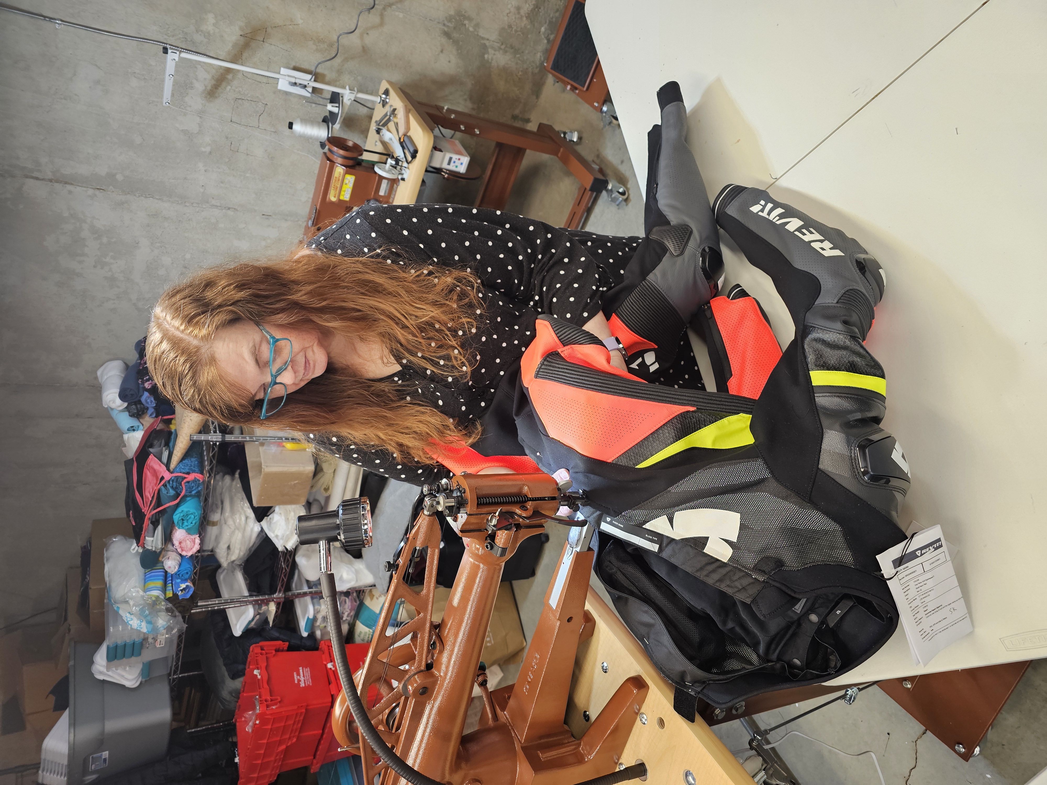 Nicole repairing a motorcycle outfit
