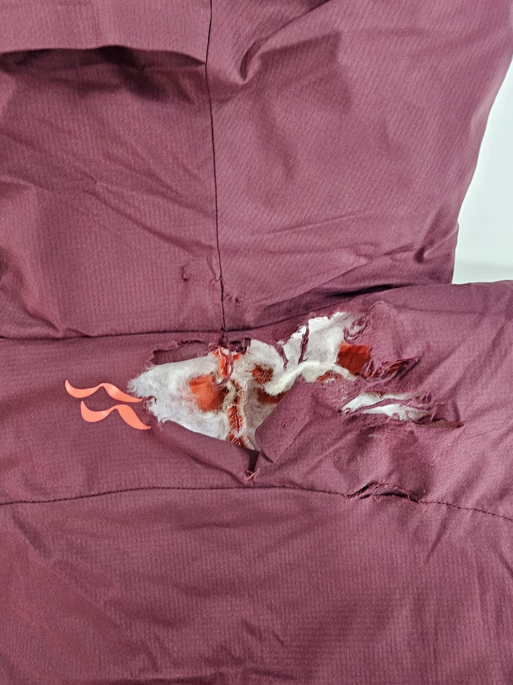 torn purple jacket damage